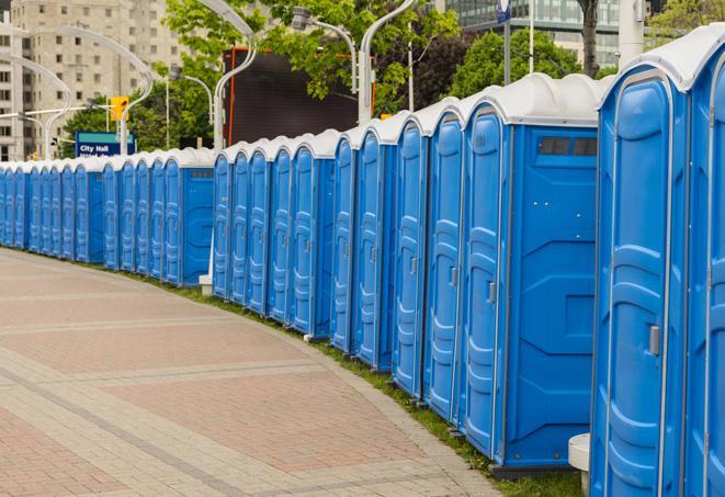 a row of portable restrooms ready for eventgoers in Bay Harbor Islands